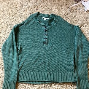 Green sweater with buttons on front